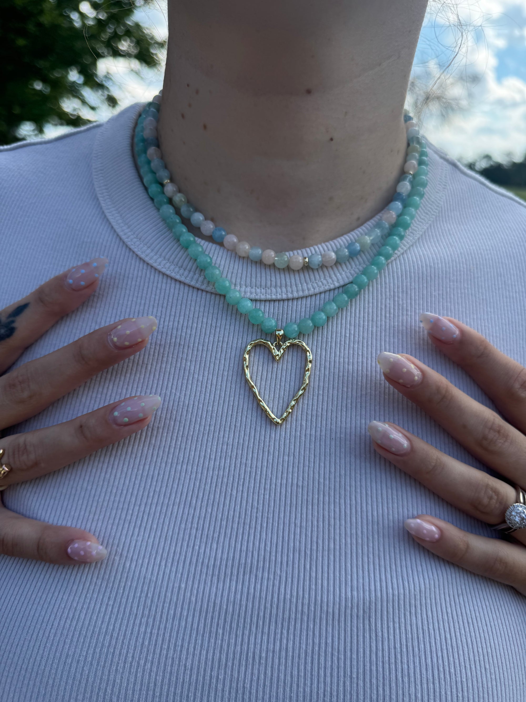 Colorful beaded necklace worn with a soft knit top